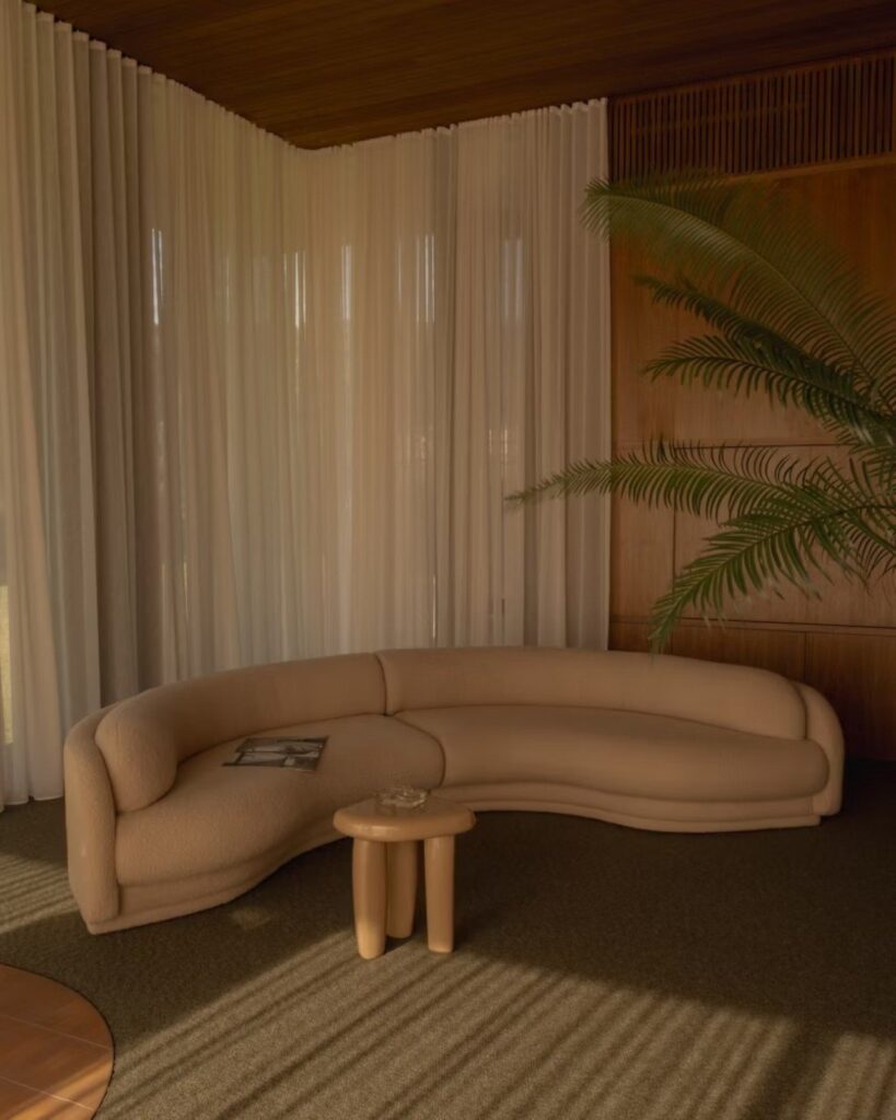 living room trends 2026 with a curved sofa, warm tones and layered textiles